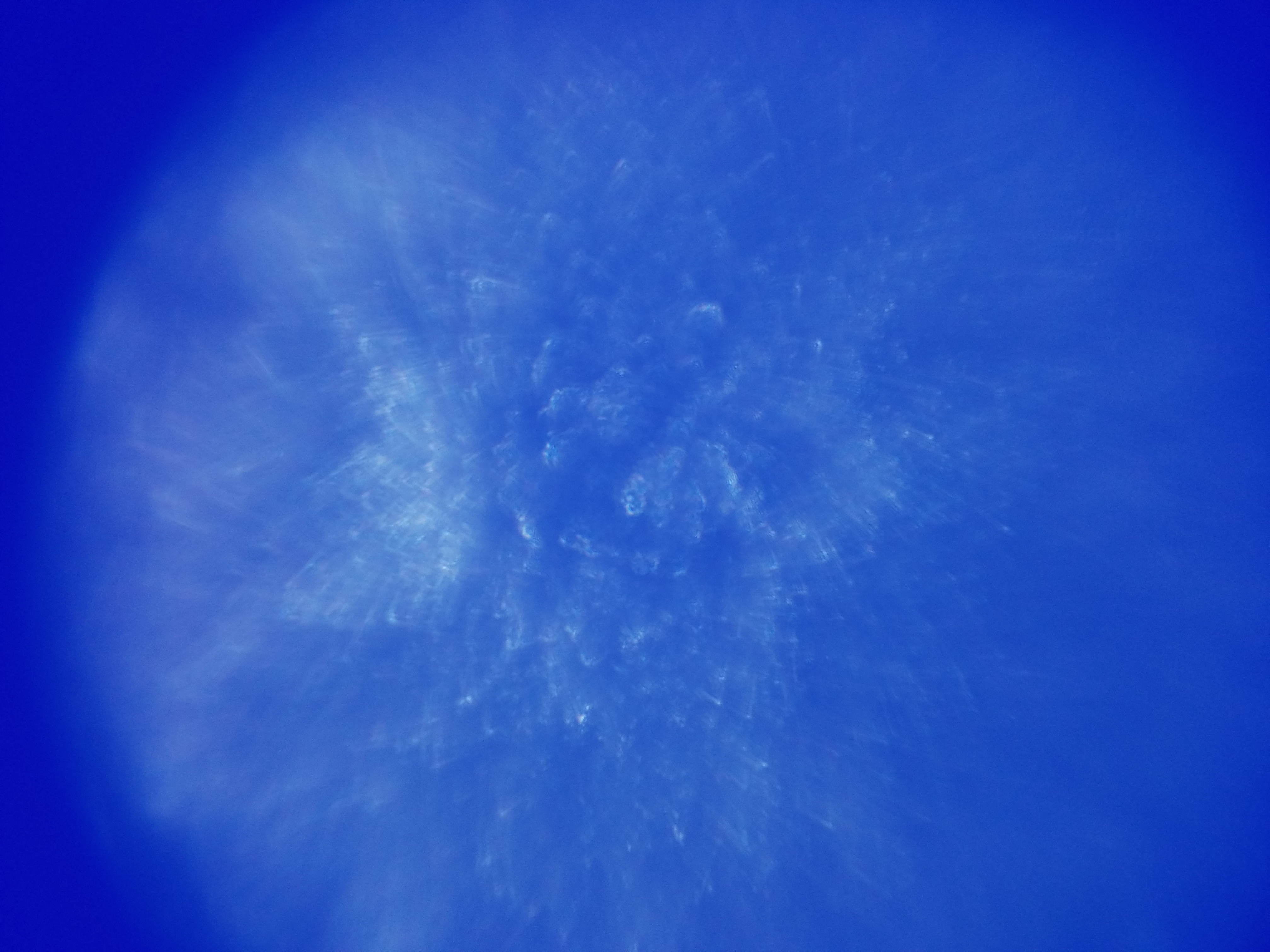 An abstract image in blue. It has a circular vignette. The image is blurry overall, however in the center there are slightly more defined spikes in white. Overall, the image is interesting, but unrecognizable. An abstract image in blue. It has a circular vignette. The image is blurry overall, however in the center there are slightly more defined spikes in white. Overall, the image is interesting, but unrecognizable.
